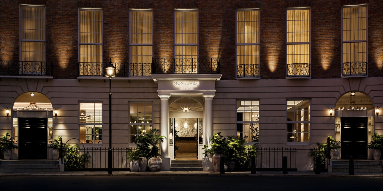 Outside of the Montcalm Mayfair hotel, a white crescent,lit up in the dark